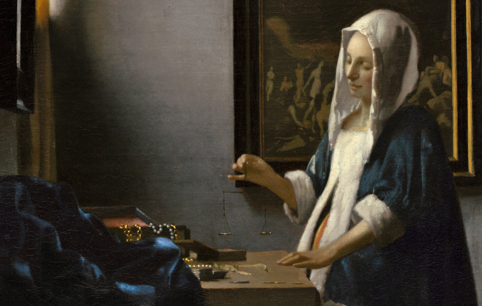 A cropped version of Johannes Vermeer's Woman with a Balance; a painting of a seemingly pregnant woman holding a small balance scale. (Scholarly opinion is that she is not supposed to be pregnant for various reasons, but to modern eyes she looks heavily pregnant).
